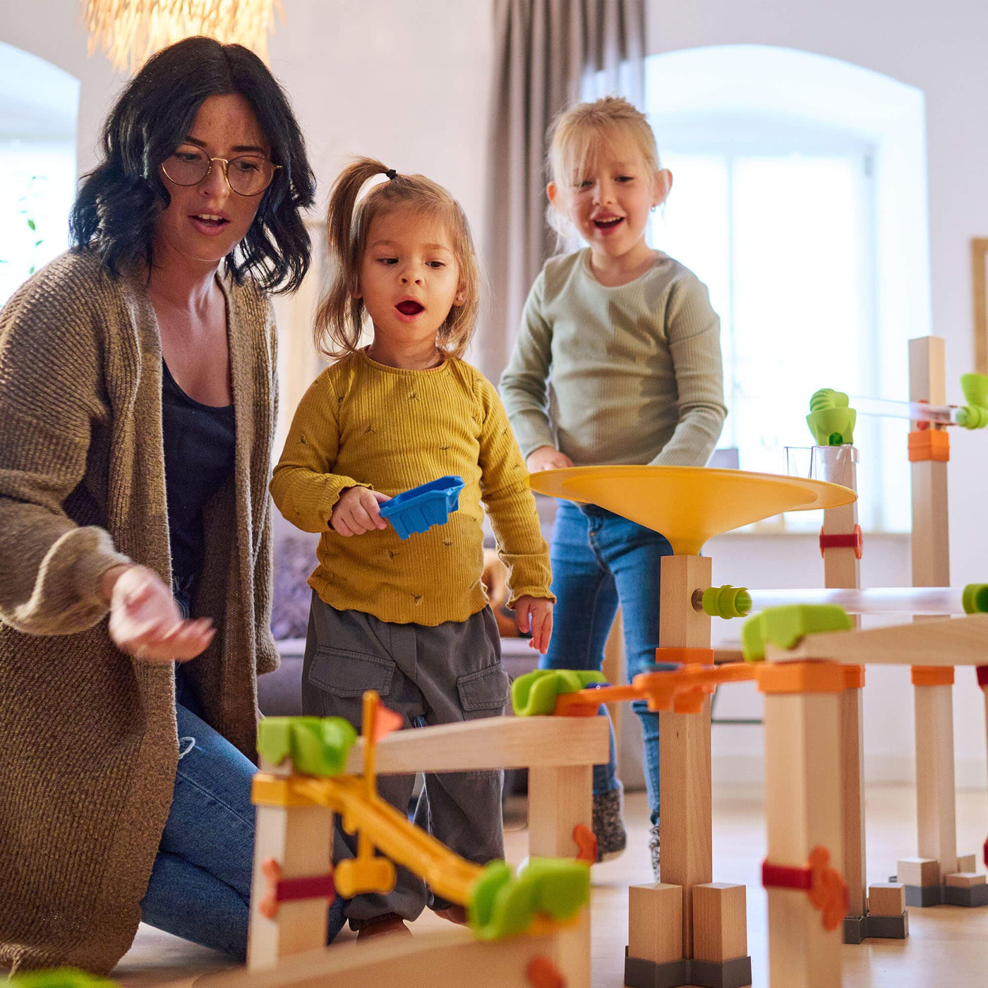 Family playing with Marble Run Master Construction Set