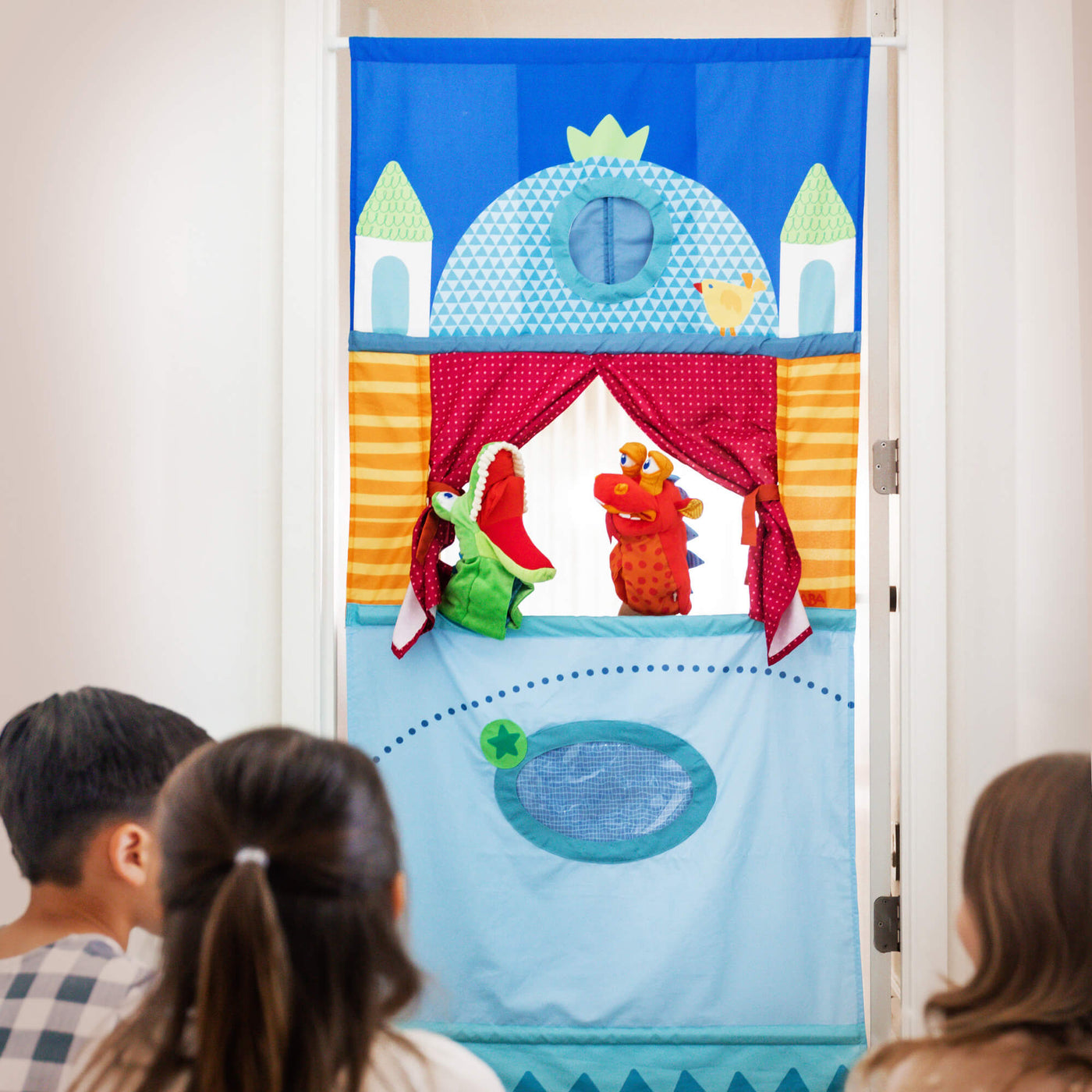 Kids playing with HABA Puppet Theater