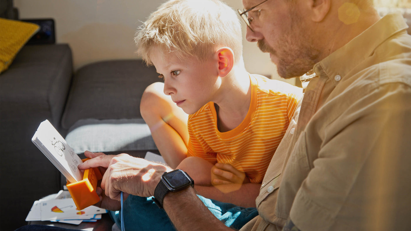 Boy and dad working through a Logic! CASE puzzle