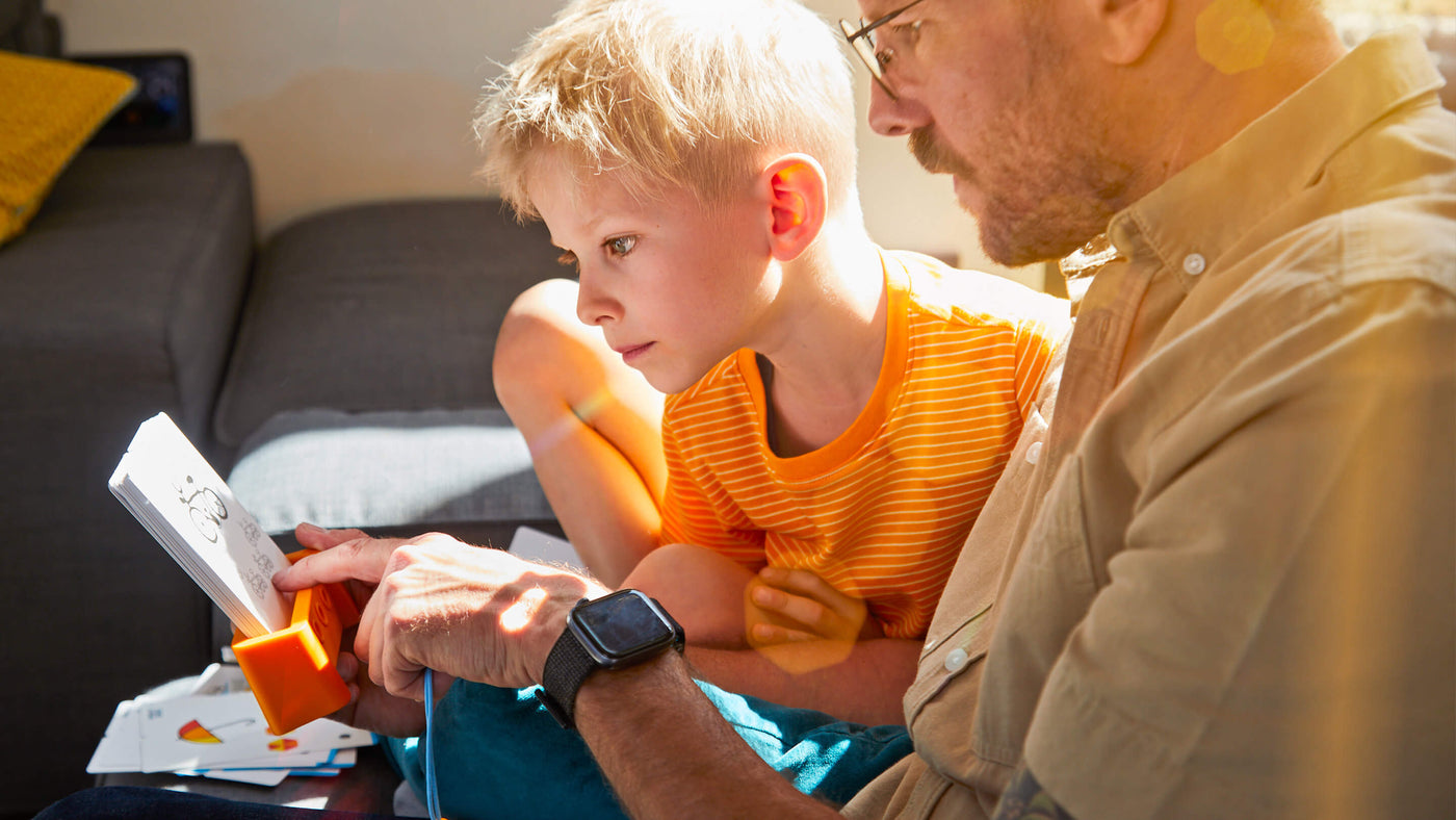 Father explaining how to solve Logic Case puzzle to his son