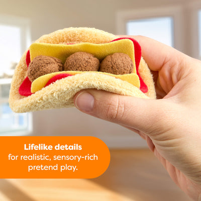 Hand holding plush pretend falafel from the HABA Creative Play Fresh Box with text reading "Lifelike details for realistic sensory-rich pretend play."