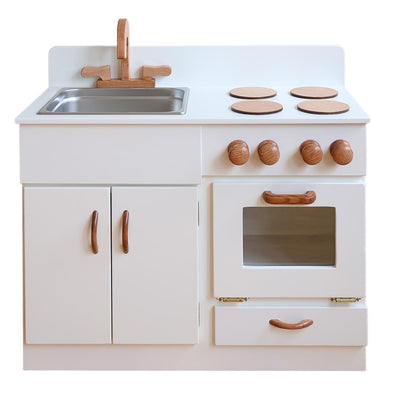 Children's play kitchen set with white cabinets, wooden handles, and a sink.