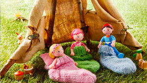 Three Little Friends figures in sleeping bags made of socks inside a teepee