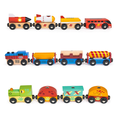Set of colorful wooden toy trains on a white background