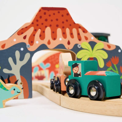 Wooden toy train set with colorful volcano landscape backdrop
