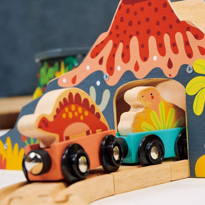 Wooden toy train with dinosaur figures on a colorful track set