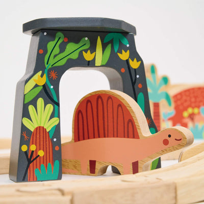 Wooden dinosaur toy with a colorful forest design on an arch