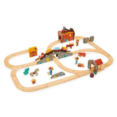 Toy train set with wooden tracks and miniature figures on a white background
