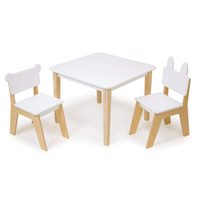 Children's table and chairs set with white seats and wooden legs on a white background
