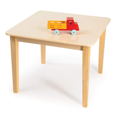 Wooden children's table with a toy truck on a white background