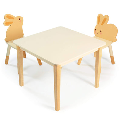 Children's table and chairs with rabbit-shaped backrests on a white background