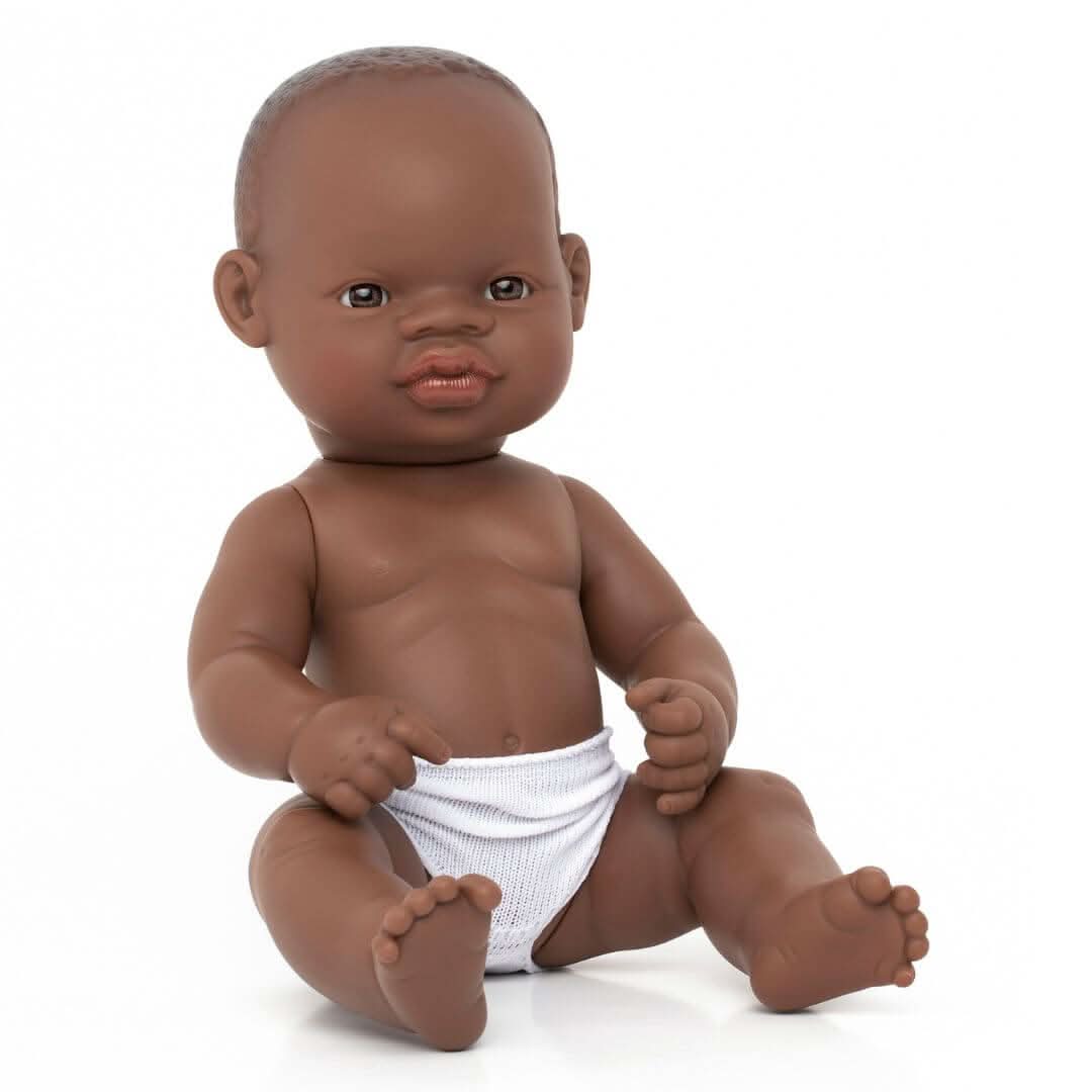 A Miniland 12-inch Realistic Montessori Black Girl Baby Doll.  Anatomically correct and designed for inclusive, educational play.