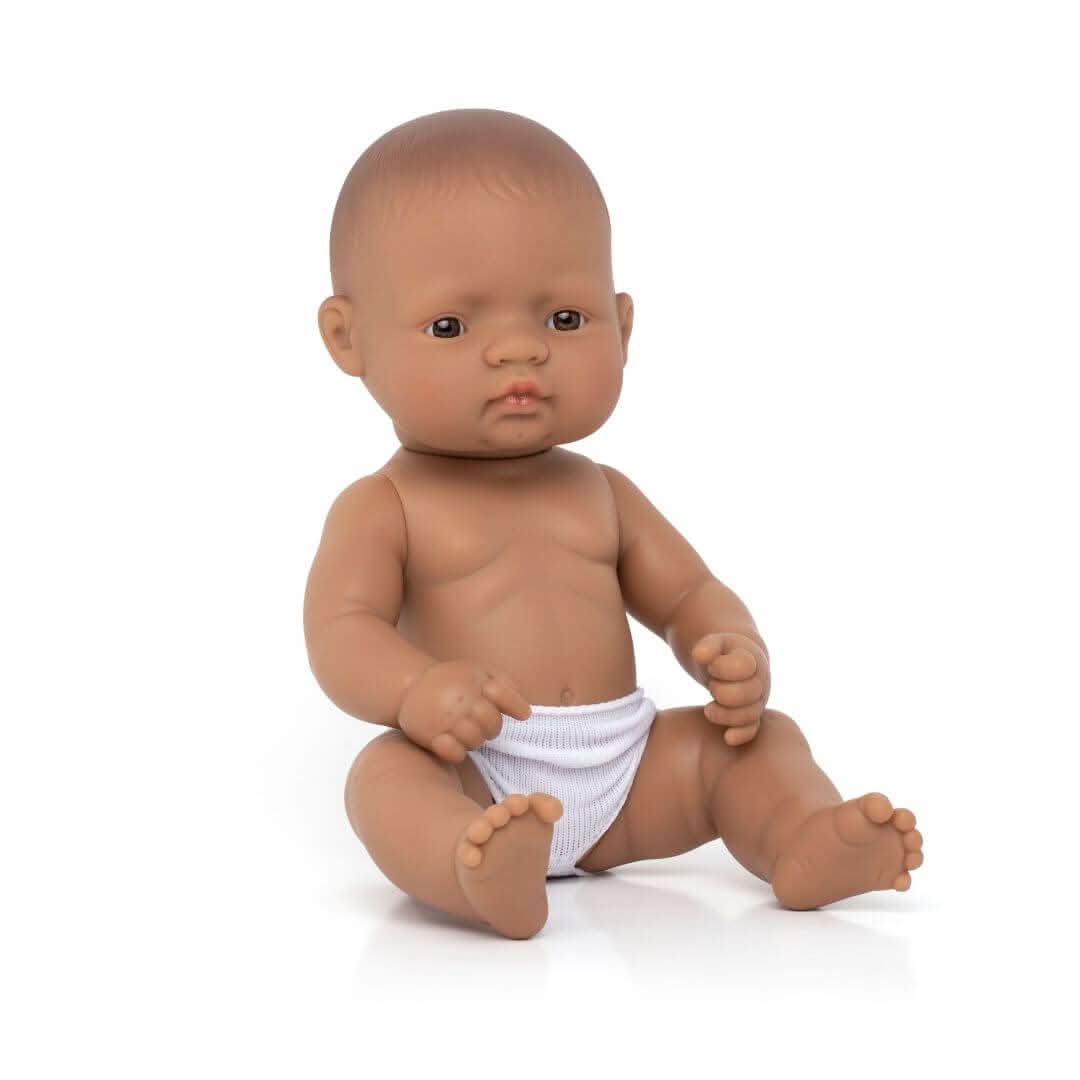 A Miniland 12-inch Realistic Montessori Hispanic Girl Baby Doll. Anatomically correct and designed for inclusive, educational play.