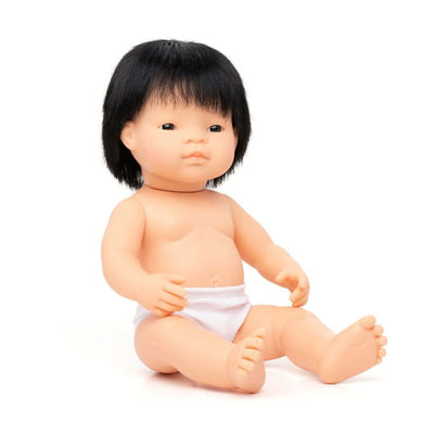 A Miniland 14-inch Realistic Montessori Asian Boy Doll anatomically correct and crafted from soft, high-quality vinyl for inclusive, educational play.