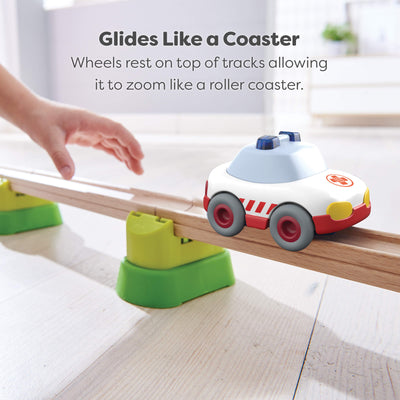 Toy ambulance on a track with text describing that is glides like a roller coaster