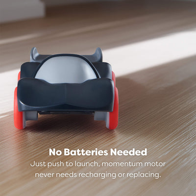 Toy car with red wheels on a wooden floor, no batteries needed text displayed.