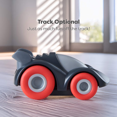 Toy car with red wheels on a wooden surface, with text 'Track Optional' above it.