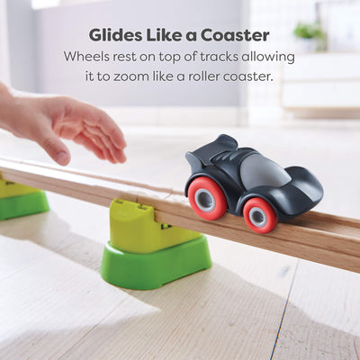 Toy car on a track with text describing that  the wheels rest on top of the tracks so it glides like a rollercoaster