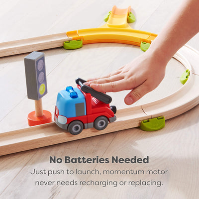 Wooden track set set with a red fire engine on a wooden track, hand pushing with it with text saying no batteries are needed