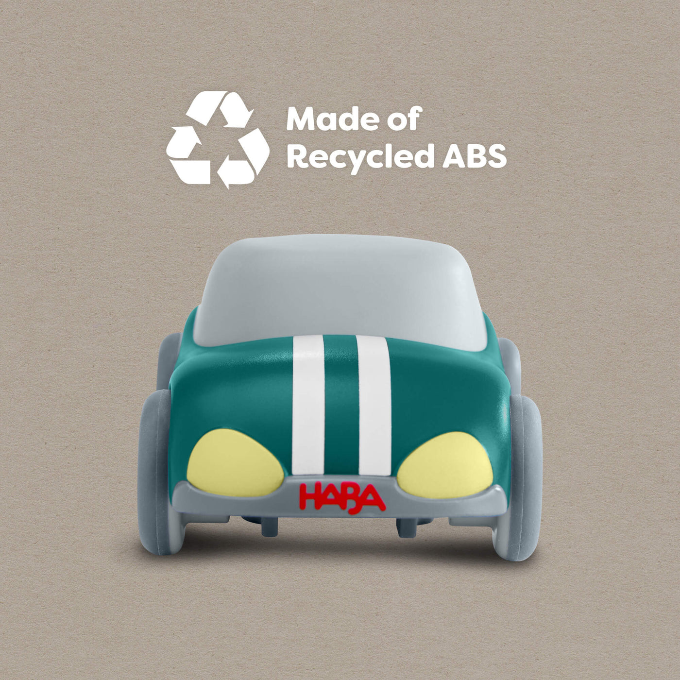 HABA Cars Green Speedster with 'Made of Recycled ABS' text and HABA logo on a beige background