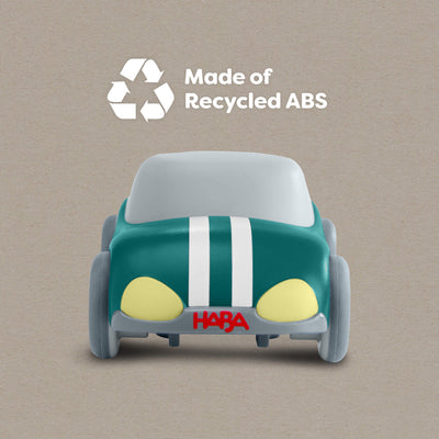 HABA Cars Green Speedster with 'Made of Recycled ABS' text and HABA logo on a beige background