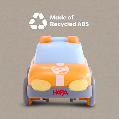 HABA car with 'Made of Recycled ABS' text and HABA logo on a beige background