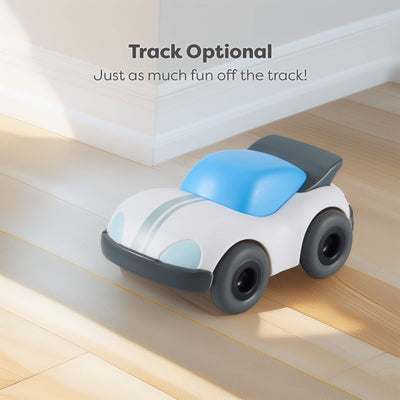Toy car on a wooden floor with text 'Track Optional. Just as much fun off the track!'