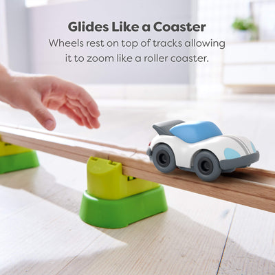 Toy car being pushed on a track, promoting a coaster-like gliding experience.
