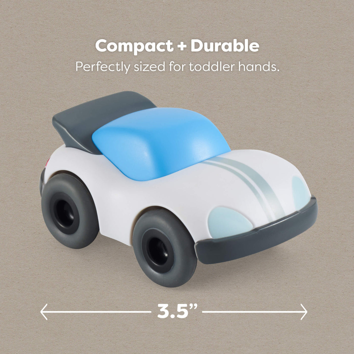 Three and a half inch toy car with blue roof and white body on a beige background, labeled 'Compact + Durable'.