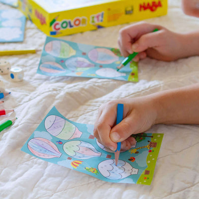 Children coloring with Color It game