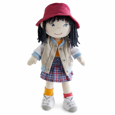 Yuki fabric doll with a red hat, tan jacket, plaid skirt, and mismatched socks.