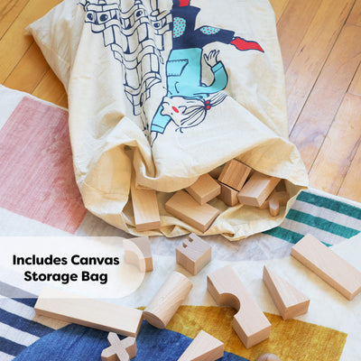 HABA wooden blocks with an included canvas storage bag on a wooden floor