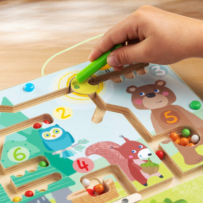 Child playing with Forest Friends Magnetic Game