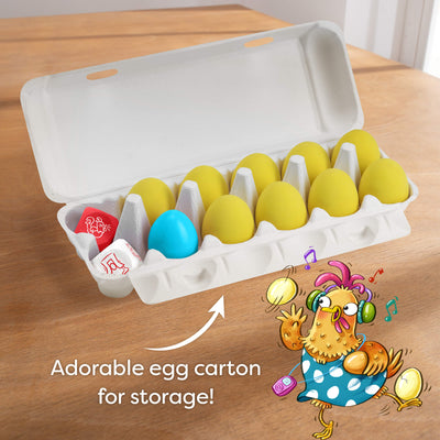 Dancing Eggs egg carton with colorful eggs on a wooden surface, featuring an illustration of a chicken character.