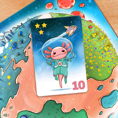 Galaxolotl card with a cartoon axolotl character in space on a colorful card game board