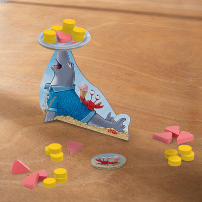 Robbi Gelato game with a seal balancing yellow and pink game pieces on a tray.