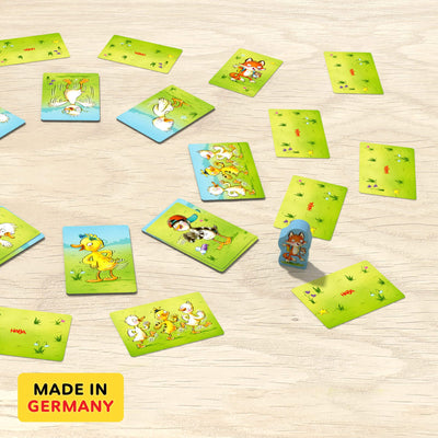 Cards on wooden table with wooden game piece from Wiggle Waggle Geese