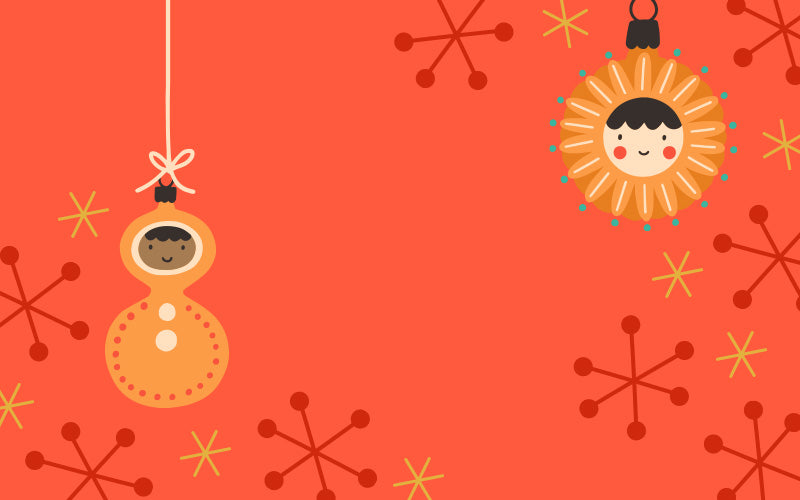 Two Christmas ornaments with faces on a festive pink background