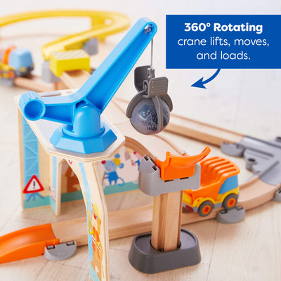 Toy crane with 360-degree rotation feature on a wooden track set.