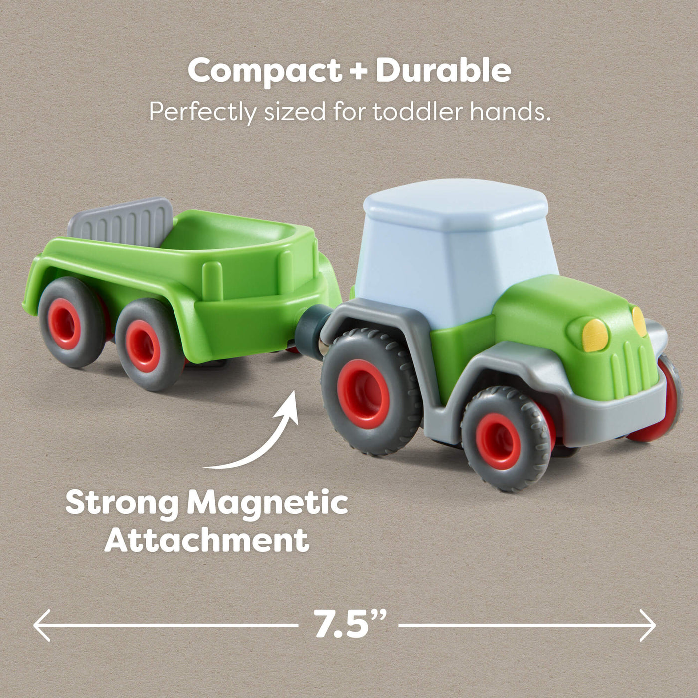 7.5" Toy tractor with trailer on a beige background, highlighting compact size and magnetic attachment.