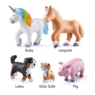 Collection of toy animals including Ruby unicorn, Leopold the horse, Leika the dog, Kitty Sally, and pig on a white background.