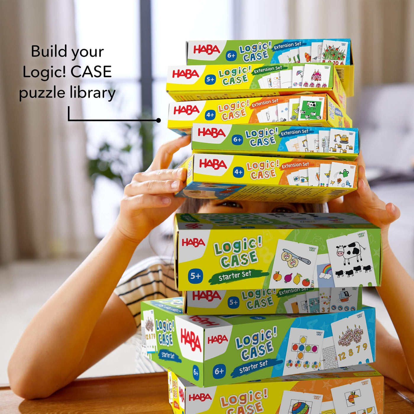 Build your Logic! CASE puzzle library! Stack of Logic! CASE game boxes on wooden table