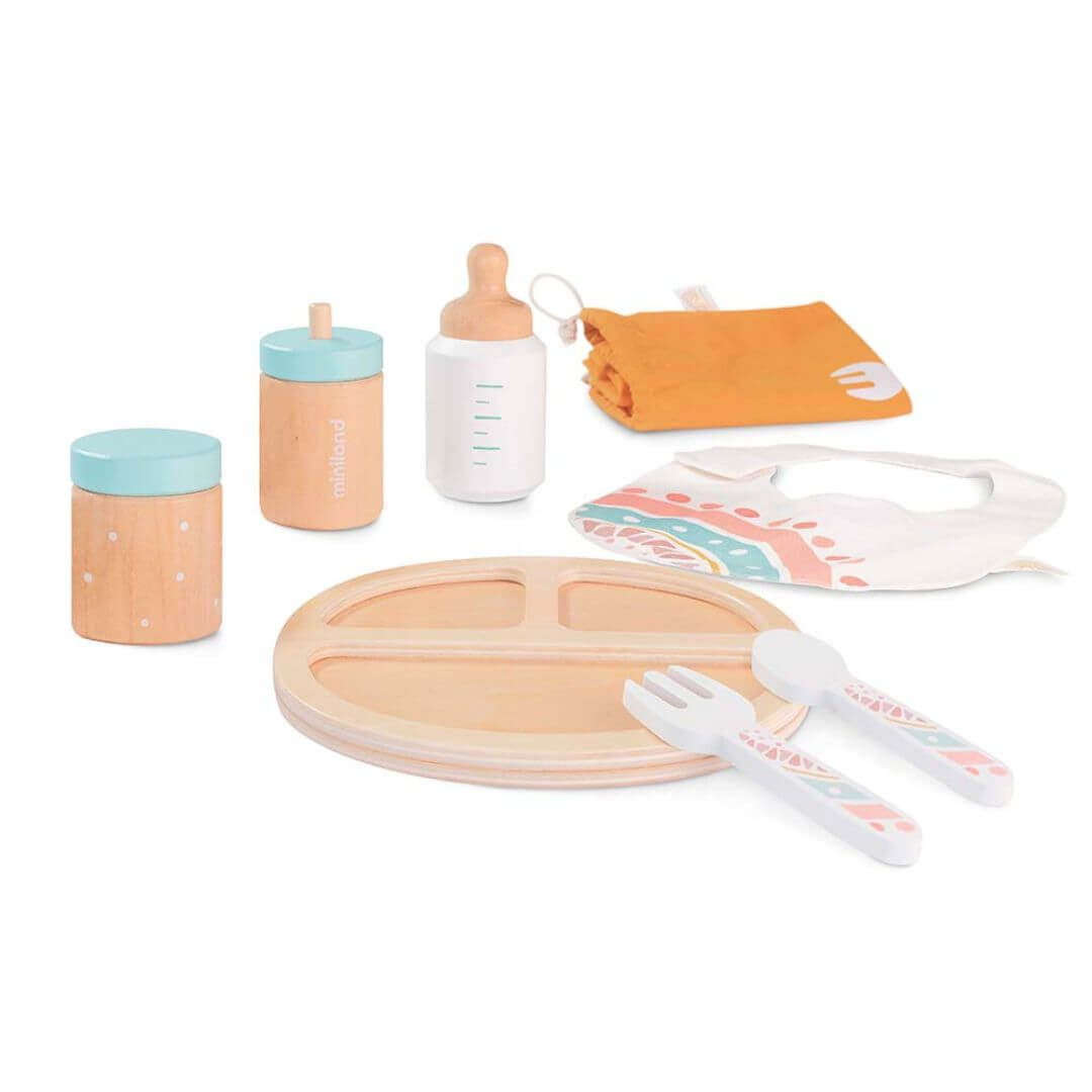 A beautifully crafted wooden doll feeding set by Miniland, made from FSC-certified sustainable wood. Includes a plate, utensils, baby bottle, food jar, bib, and washcloth in soft, natural tones.
