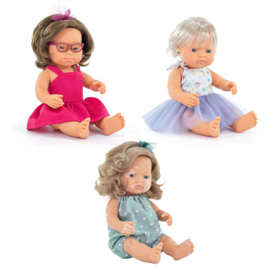 Three dolls with different abilities and outfits on a white background