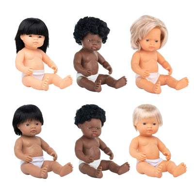 Set of six dolls with different skin tones and hairstyles on a white background