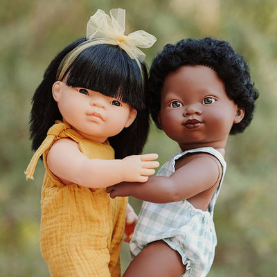 2 14-inch Miniland Dolls from the My Friends & Me Collection, featuring realistic details, soft vinyl construction, and designed to promote friendship and inclusivity.