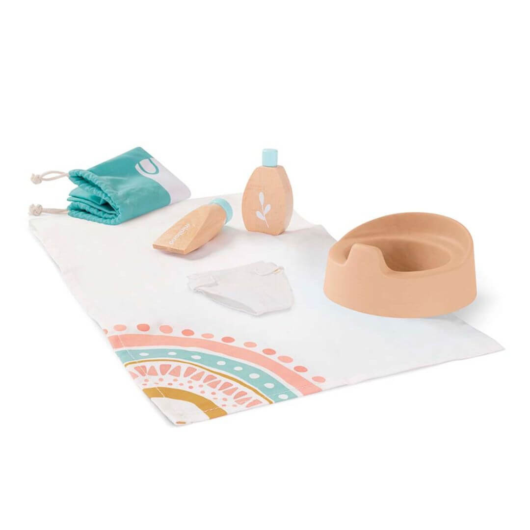 A wooden doll care set by Miniland, featuring a doll potty, wooden lotion bottle, soap, fabric changing mat, washcloth, and a storage bag, made from FSC-certified sustainable wood for nurturing pretend play.