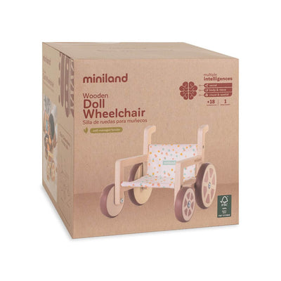An image of the box that the Miniland Wooden Doll Wheelchair with a polka dot fabric seat and natural wood frame comes in.