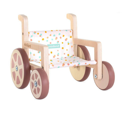 Miniland Wooden Doll Wheelchair with a polka dot fabric seat and natural wood frame, designed to fit 14-inch dolls, shown on a white background.