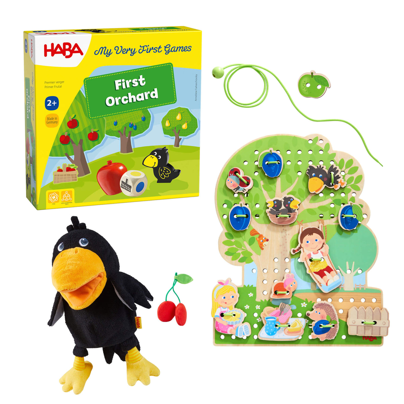 HABA 'First Orchard' game set with bird puppet and tree threading board on a white background